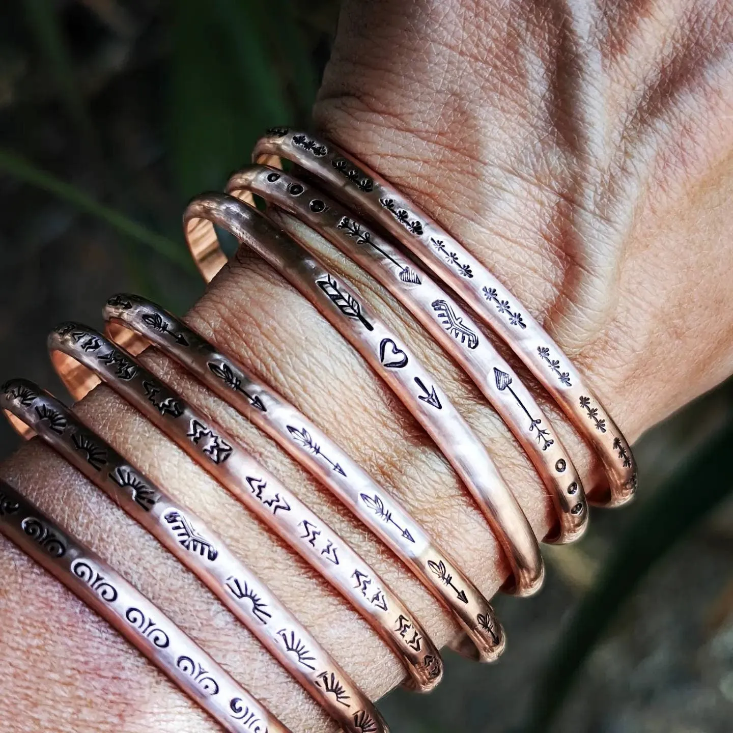 Copper cuff bracelets with stars and Thunderbird arrows