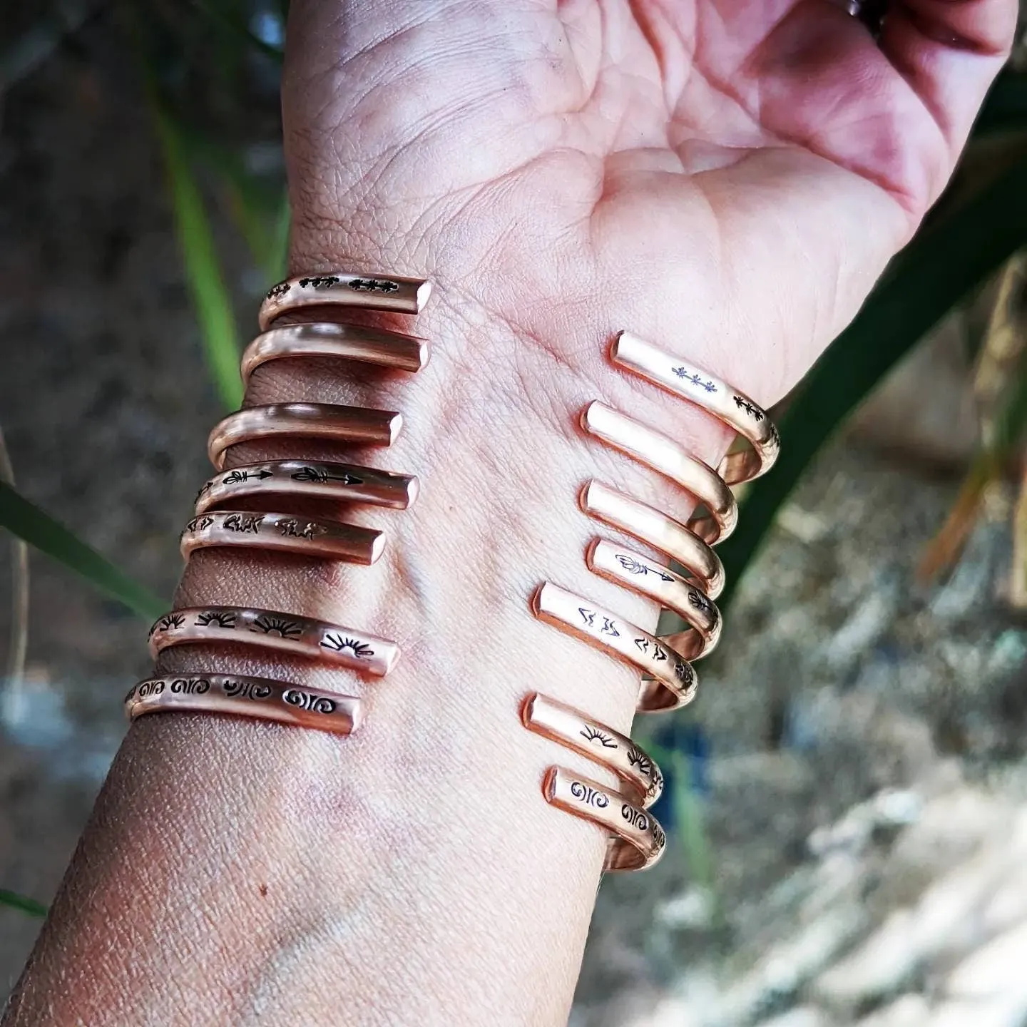 Copper cuff bracelets with stars and Thunderbird arrows