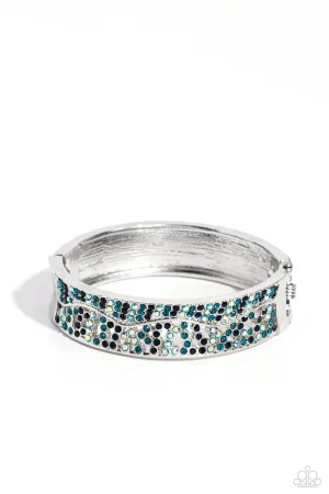 Wavy Whimsy - Blue - and Iridescent Rhinestone Paparazzi Hinge Bracelet